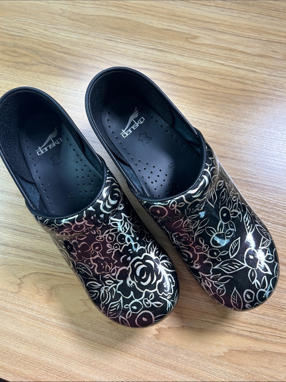 Dansko Black Floral Patent Clogs